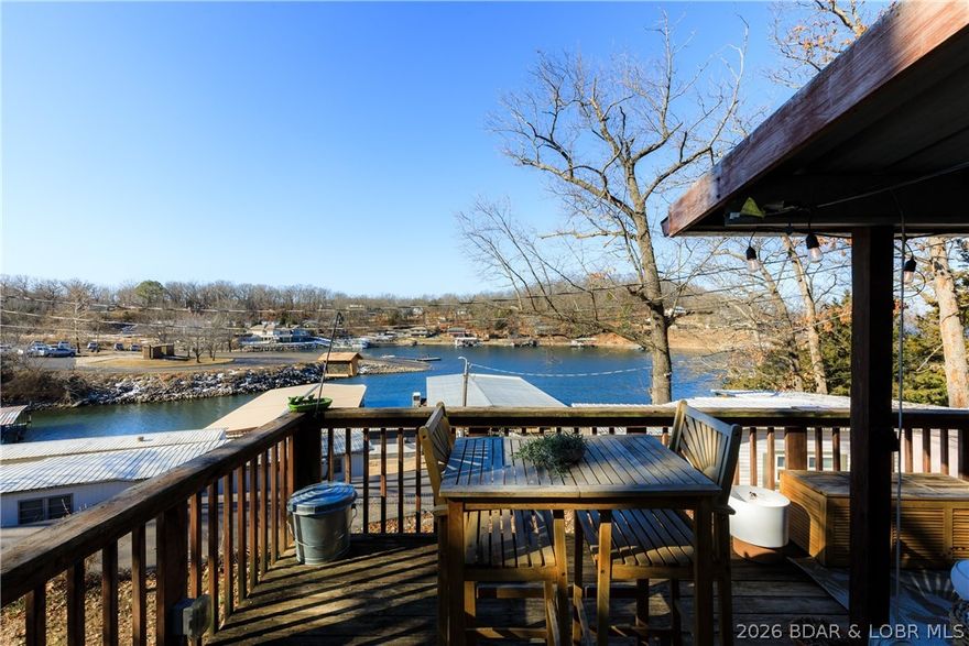 Welcome to 78 Betlo Park Drive in Sunrise Beach—an inviting, updated 2BR/2BA home ideally located at the 11MM of the Osage Arm, directly across from the Shawnee Bend boat launch. Enjoy easy access to open water, popular lakefront dining, and year-round recreation in a peaceful, private, pet-friendly community. Take in beautiful lake views from the welcoming front porch. Inside, this warm & cozy home features new subflooring, luxury vinyl plank flooring, an updated kitchen, upgraded lighting, & refreshed bathrooms w/ heated bidet seats. Additional features include central air & heat, smart thermostat, backup window unit, & a durable metal roof. Outdoor amenities include an insulated 9x12 man-cave/storage shed w/ electric & a new AC unit, a 3x5 metal tool shed, fishing rack, raised garden beds, propane grill, Big Green Egg smoker, & a bedroom window catio. The home is sold fully furnished w/ washer/dryer, major appliances, furniture, décor, and patio furnishings (excluding personal items). Situated on a leased lot ($850/month), the property includes a 10x20 boat slip with lift, plus access to a community pool and private swim dock—ideal for seasonal living or a weekend lake getaway.