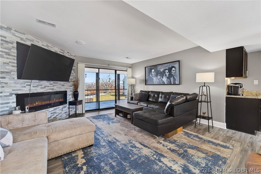 TURNKEY AND SO SPACIOUS!!! This 3-bedroom, 2-bath has a massive screened-in veranda with lake view. The Lake famous Hippopotamus swim up bar is just a short walk away, along with the complex's additional 6 pools. Did I mention your amenities include Four Seasons indoor & outdoor pools, parks, pickleball court, private stocked fishing lakes, campground, boat ramp and so much more. The unit itself is inviting and updated with LVP flooring, granite countertops, and stainless-steel appliances. Every room has a lovely view with sliding door access to the veranda. Great rental potential with central location and access to premier amenities. The Bagnell Dam strip, shopping, dining and marinas are just a short drive. If you are looking for a getaway with the perfect combination of relaxation, comfort and access to fun THIS IS IT!!!