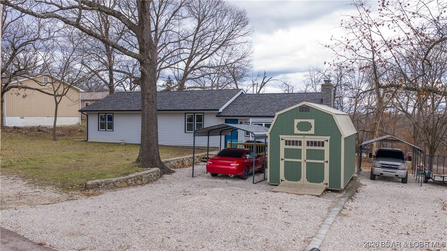 Completely remodeled in 2024, this move-in-ready 2 bedroom, 2 bath home is tucked away on a quiet cul-de-sac in the heart of Camdenton, offering added privacy along with a rare, large .41-acre flat lot. With 1,634 square feet of living space, the home has been thoughtfully renovated from top to bottom — including a new roof, new flooring, updated cabinetry, modern vanities, and stainless steel appliances. The spacious layout provides comfortable living and functional flow, while the expansive yard offers plenty of room for outdoor enjoyment, future expansion, or gardening. Two carports provide convenient covered parking, and a storage shed at the rear of the property adds valuable space for tools, equipment, or hobbies. Serviced by city water and sewer, this property delivers peace of mind with in-town convenience, just minutes from local shops, schools, and everyday amenities. A fully updated home on a private cul-de-sac lot in Camdenton — this one truly checks all the boxes.