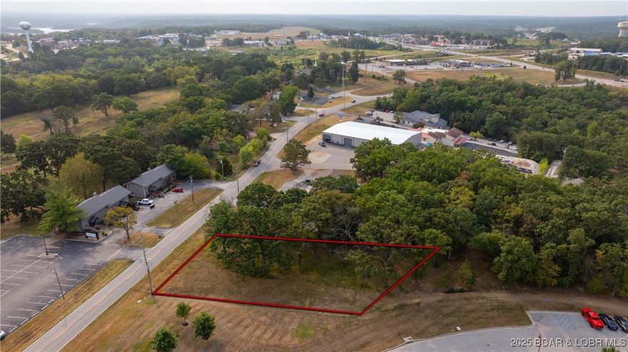 Exceptional Commercial This C-1 zoned property boasts over 110 feet of prime Highway KK frontage with a MODOT-approved entrance & second entrance of neighboring street, offering unmatched visibility and easy access for customers. Sitting on just over a half acre with city water, sewer and electric. This parcel is development-ready for your dream project. Nestled right in the heart of activity & growth at Lake of the Ozarks in Osage Beach. Directly across from the popular Jeffries Fine Dining and next to KK Jewelers, this lot is surrounded by thriving neighborhoods, numerous condo developments, and marinas. Just minutes from the Highway 54/KK overpass, it’s perfectly positioned near the area’s largest retirement community, Margaritaville Resort, golf courses, RV parks, and countless attractions that keep the area buzzing year-round. Originally envisioned for a restaurant, the flexible C-1 zoning opens the door to countless possibilities — retail, dining, office, or entertainment. With high traffic, outstanding visibility, and constant growth in the surrounding area and truly a can’t-miss opportunity to make your mark in one of the lake’s most sought-after commercial corridors.
