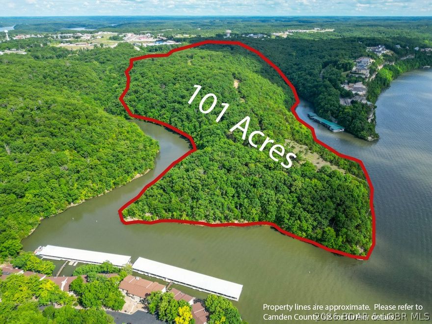 Opportunities like this are becoming rare at Lake of the Ozarks. This breathtaking ±101-acre tract with nearly a mile of shoreline is the premier large-scale development site on the lake. Perfectly positioned at the 27 MM and easily accessed from Hwy 54, the property combines outstanding visibility with convenient access. Approximately 36 acres is zoned commercial, while the remaining 65 acres are zoned residential, creating an opportunity for a thoughtfully designed mixed-use project. Whether your vision is a luxury resort, hotel, condominium development, or an upscale residential community, this property provides the scale & setting to make it happen. The land features rolling ridges that gently taper toward the water, creating highly buildable areas with sweeping views of the main channel & 2 scenic coves. The incredible views area a reminder of the premier location you’re investing in. You are just minutes from the lake’s top dining, shopping, golf, & entertainment. Properties of this size, location, and versatility rarely reach the market. Walk the land once and you’ll immediately recognize the possibilities of where the next landmark development at Lake of the Ozarks begins.
