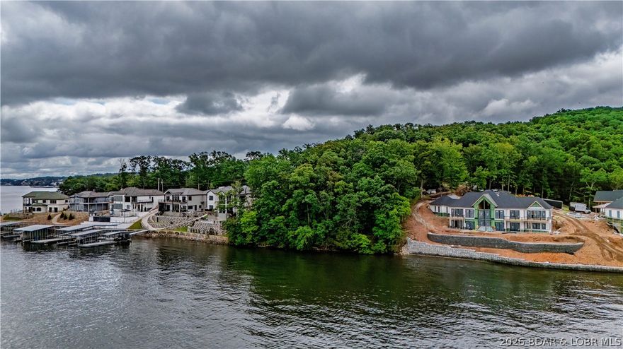 Build your dream lakefront getaway on this incredible lot located at the highly desirable 5 Mile Marker of Lake of the Ozarks! Offering breathtaking main channel views, this property provides the perfect setting to enjoy everything lake life has to offer. Whether you're looking to build a full-time residence, vacation home, or investment property, this lot offers outstanding potential. Enjoy easy access by both land and water, while taking in stunning panoramic lake views, boating activity, and unforgettable sunsets. The location places you near popular waterfront dining, entertainment, and shopping while still allowing for privacy and relaxation. An added bonus — short-term rentals are permitted once you build, making this an excellent opportunity for income-producing potential or offsetting ownership costs. Lakefront lots in this location with rental flexibility are becoming increasingly rare. Don’t miss the chance to own a premier lakefront property in one of Lake of the Ozarks’ most sought-after areas!