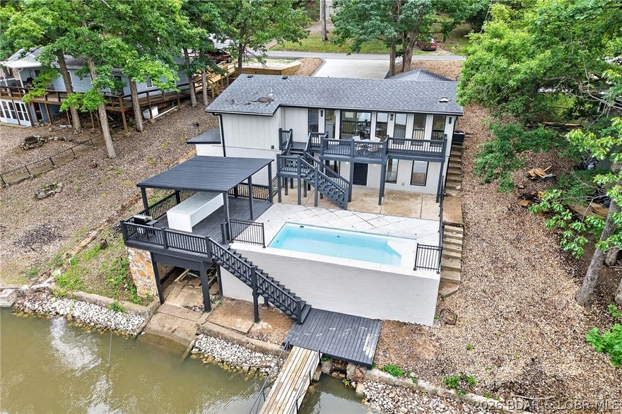 LAKE LIVING AT ITS FINEST! Spectacularly remodeled waterfront retreat in Sunrise Beach, perfectly positioned on a peaceful no-wake cove with a sparkling in-ground pool for the ultimate lake lifestyle. Effortless entertaining & everyday relaxation, filled with natural light & showcases fresh interior & exterior paint throughout. Inviting Great Room with fireplace flows seamlessly into the beautifully reimagined chef’s kitchen featuring a dramatic waterfall quartz eat-in island, stainless steel appliances & pantry. Retreat to the private primary suite offering a spa-inspired en-suite with double vanity & walk-in shower. 3 additional bedrooms and 2 full baths provide plenty of space for family and guests. Step outside & experience true resort-style lake living with multiple outdoor spaces including expansive deck, patio, covered patio, private dock & boat slip—perfect for sunset evenings, boating days & lakeside gatherings. Excellent location with easy access off the main road: new blacktop leading to the property. Oversized double driveway offers abundant parking for guests. Conveniently located near premier lake dining, entertainment and all the amenities Sunrise Beach has to offer.