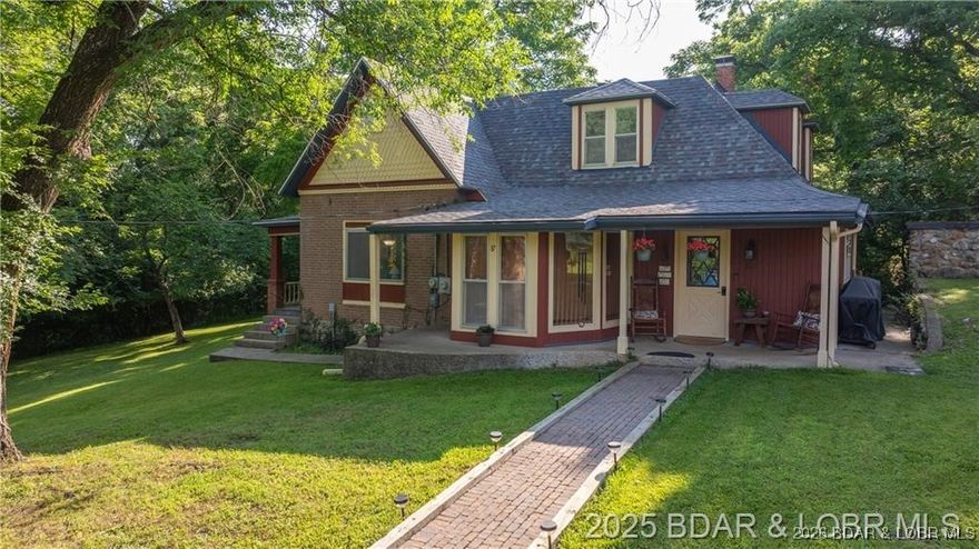 Own a piece of historic Old Linn Creek with this beautiful and well maintained home from 1884 just steps to the lake! This gorgeous brick home features 4 bedrooms, 2 bathrooms, and approximately 1.6 acres for your enjoyment. There is also plenty of room for your hobbies and storage with an RV pad and detached shop/garage. Although there are still pieces of the home from 1884 this home has had many updates through the year such as a new roof in 2022, new well pump and tank in 2015/16, and several others - it's the perfect mix of historic and new for you and your family to enjoy! The land is flat and secluded, with an outdoor fire pit ready to create countless summer memories with no HOA to worry about. This will be a house you never forget about, check it out today!!