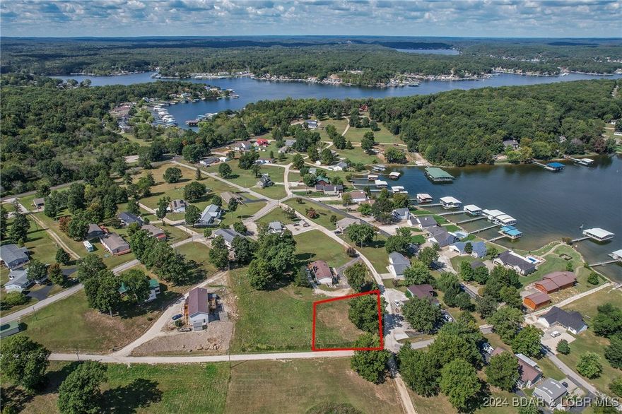 Johnson's Bay subdivision is a HOT market for lake access/view lots! Here's another one to choose from. This corner lot has both lake view and access through subdivision boat ramp! Lot sits 3rd tier and offers water and sewer hook ups. Just under 1/2 an acre to build the lake home you've always wanted. Great lot to either build on crawl space or even a walk out lower level! Come check it out today!