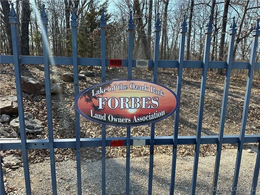 Discover 11 m/l wooded acres with gently rolling terrain — an ideal setting to build your getaway or full-time home surrounded by nature. Situated off Kip Drive within the gated Forbes Lake of the Ozarks community, residents enjoy access to 3 boat ramps, 3 stocked interior lakes, a clubhouse, RV park, tennis and basketball courts, a gun range, and more. Property is not intended for recreational use. Shown by appointment only with a licensed realtor. Community guidelines available at www.forbesloa.com.