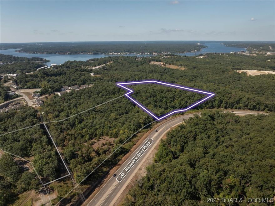 Over 14 acres of commercially zoned ground in central Lake Ozark.  Big things are happening in this area, why not get in on this ground now.  This piece has access off of Hwy 242 and substantial visibility.  Adjacent piece also available if you are looking for more ground or more highway frontage.  The 14 acres has varying topography with a large flat spot up top and then a pretty steep drop down to Hwy 242.  Water and Sewer are close and this property is in the TIF district.  Development is going to happen in Lake Ozark and this could be the next spot!