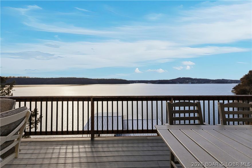 Located in the iconic Tan Tar A Estates, adjacent to Margaritaville Resort, this truly one-of-a-kind home stands out for its exceptional size, character, and unbeatable main channel views. This home features low-maintenance Trex decking and is fully furnished—completely move-in ready. The thoughtfully designed floor plan offers generous space with two full kitchens, multiple dining areas, and family rooms—ideal for hosting large gatherings or accommodating multiple families. Spacious bedrooms each include their own private full bathroom, providing comfort and privacy for all. Enjoy FREE year-round golf and the convenience of a true golf cart community with quick access to Margaritaville Resort amenities, including a swim-up bar, lakeside dining, Tiki Hut with live music, pools, waterslide, splash pad, spa, full-service marina, bowling alley, arcade, billiard room, and more. Centrally located by land and water,  easy access to Highway 54 and all of the area’s top attractions, dining, shopping, and entertainment. Whether you’re seeking a full-time residence, a lake getaway, or an investment opportunity, this spacious and distinctive property delivers on every level.