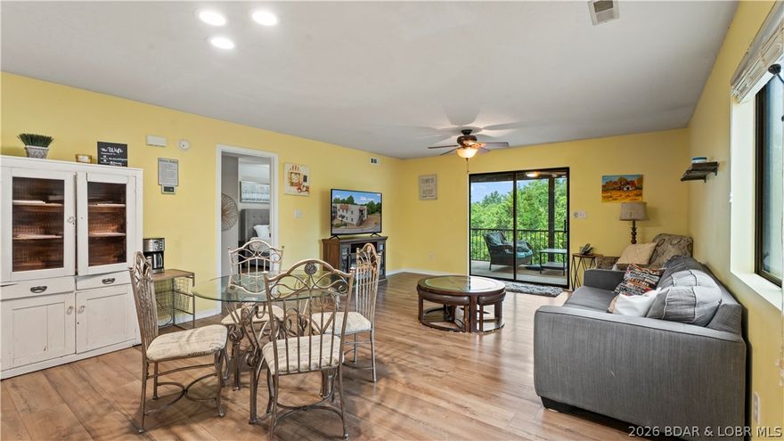 Welcome home to the Osage Vista's community. This top floor unit is perfectly situated toward the back of the property overlooking a serene wooded area with wildlife presence. Step inside to a beautifully updated 3 bedroom, 2 bathroom, open floor plan with over 1200sqft of living space, and a new HVAC in 2024. The master bedroom features its own private bathroom that includes a walk-in shower, and walk in closet. Off of the large living area is a screened back porch great for evening relaxation and grilling. The complex is equipped with 6 pools, a playground, and plenty of acreage for walking your pets, riding bikes, or strolling around in your golf cart. Use it as an air b & b as it is home to the Hippo swim up bar offering summer concerts, and an indoor bar & grill. This adorable condo also has access to four seasons amenities such as an indoor pool, fitness center, campground, pickle ball courts, dog park, boat trailer parking, and more. Within 5 minutes of the Bagnell Dam Strip, dining, boat ramps, golf & shopping this condo is sure to check all the boxes for full time lake life or investment opportunities! Don't skip out on seeing this one. Make an appointment to view today!