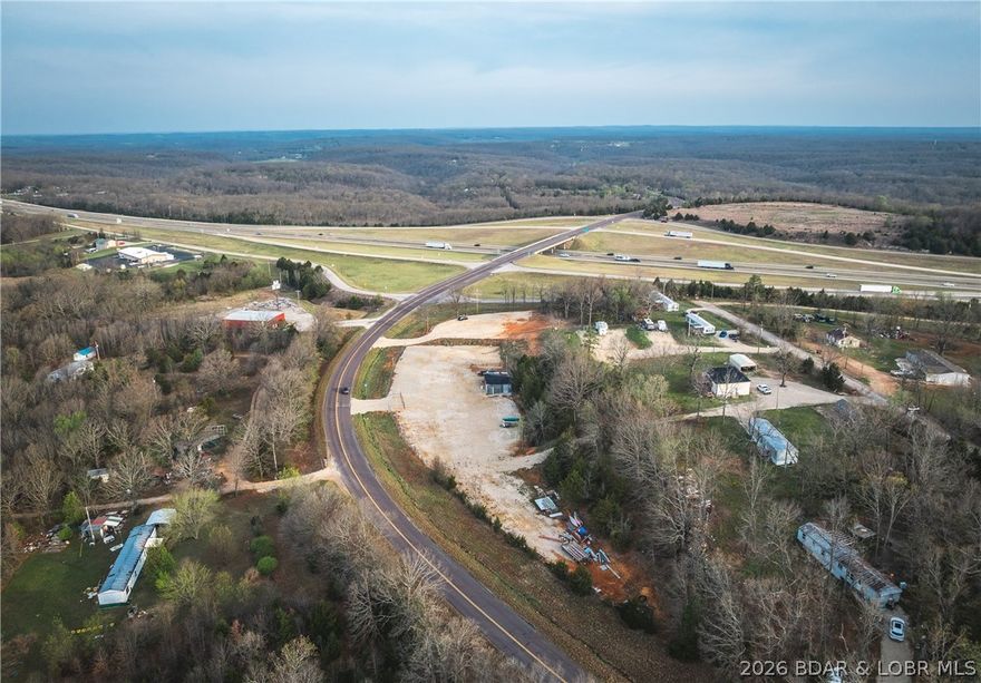 Prime commercial opportunity with high-visibility 
Positioned at the Highway 7 exit off I-44 between Saint Robert and Lebanon, this versatile 3 m/l acre property offers outstanding access and exposure in one of central Missouri’s most traveled routes. Located just minutes from Richland and within a short drive to Lake of the Ozarks, this site is ideally situated for a wide range of commercial or investment uses.
The property is partially fenced and gated, providing added security and flexibility for development. With water and electric already available on-site, much of the groundwork is in place to bring your vision to life. The seller is willing to subdivide, making this an excellent option for buyers seeking a smaller parcel or multiple development opportunities.
I-44 is a major east-west corridor with strong daily traffic flow—typically seeing tens of thousands of vehicles per day offering exceptional visibility and consistent exposure for any business venture.
Whether you're considering retail, service-based business, storage, or other commercial development, this location combines accessibility, infrastructure, and growth potential in a thriving area of the Ozarks.