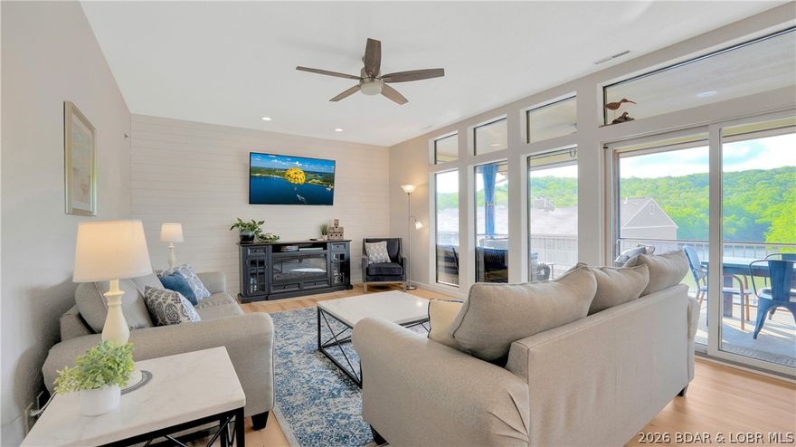 **TURNKEY!** Experience effortless lake living in this beautifully updated Osage Beach condo. Featuring new luxury vinyl plank flooring, a striking electric fireplace with shiplap accent wall, and a stylish kitchen with new stainless steel appliances and soft-close cabinetry, this home blends comfort with modern appeal. The open layout is perfect for relaxing or entertaining, while the prime location next to one of the community’s two pools makes summer enjoyment easy. Includes a coveted 10x24 boat slip with lift for instant water access, plus a garage/storage unit for added convenience. Ideal as a full-time residence, weekend getaway, or investment property, this move-in-ready gem is just minutes from shopping, dining, and entertainment—offering the very best of the Lake of the Ozarks lifestyle.