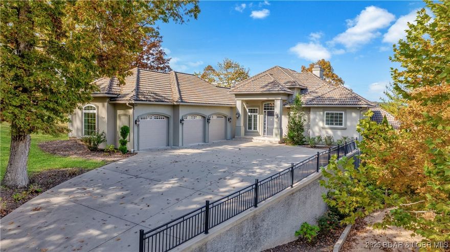 BACK ON MARKET DUE TO NO FAULT OF THE SELLER! Perched on a bluff at the 39 MM, this custom-built 2010 masterpiece blends timeless craftsmanship with sweeping Lake of the Ozarks views. Nearly 5,000 sq ft of refined living showcases tall ceilings, five fireplaces (4 gas, 1 wood-burning), four wine coolers, and a chef’s kitchen with gas range, warming drawer, wine cooler, walk-in pantry, and elegant finishes throughout. Step outside to your private pool, hot tub, outdoor half bath, and expansive patio—perfect for entertaining as sunsets dance across the water. Access is easy no matter where you want to go, a private elevator will take you downstairs an the included UTV takes you to your 12x38 dock slip with hoist in about 30 seconds, with a second 12x32 slip available for purchase. Located on nearly an acre this home is designed for comfort and peace of mind with three furnaces, two generators, and a spacious three-car garage and generous driveway parking. This home is offered fully turnkey with furnishings and décor, this rare property captures the essence of luxury lake living—where every detail is designed for relaxation, connection, and unforgettable views.