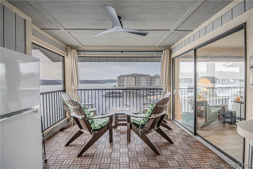 Situated at the Osage 1 mile marker, this top-floor condo offers convenience just off Hwy 54 in Spinnaker Point Condominiums. Boasting vaulted ceilings and ample windows, this condo beams with natural light and offers breathtaking lake views! Impeccably maintained, it presents two spacious bedrooms, two baths, all on a single level. With a thoughtfully designed floorplan and a serene covered screened deck, this condo exudes comfort. A must-see for those seeking location and value, it comes with most furnishings and a 10 x 24 slip, boat lift and PWC slip. Spinnaker Point, a small homeowner-run complex offering on-site amenities such as a splendid pool, clubhouse, and fish cleaning station at the docks. Conveniently positioned just off Hwy 54, it's a short drive to Lake Ozark's shopping, dining, and entertainment options. Don't miss out on this unbeatable location and value—schedule a viewing today!