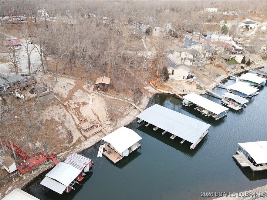 Build your Lake of the Ozarks getaway! This 0.73-acre lot located on TBD Glasgow Road in Rocky Mount, Missouri offers a great opportunity to build your dream home or weekend retreat. Situated within the Ozark Shores community, the property includes community dock access, making it easy to enjoy lake days, boating, and waterfront fun without the maintenance of a private dock. The gently sized parcel provides flexibility for building while still offering privacy and a peaceful setting. Access to hook up to Community Water.  Conveniently located near local dining, shopping, and all the Lake of the Ozarks attractions, this lot is perfect for full-time living or a vacation escape. Don’t miss your chance to own a piece of lake life at an affordable price!