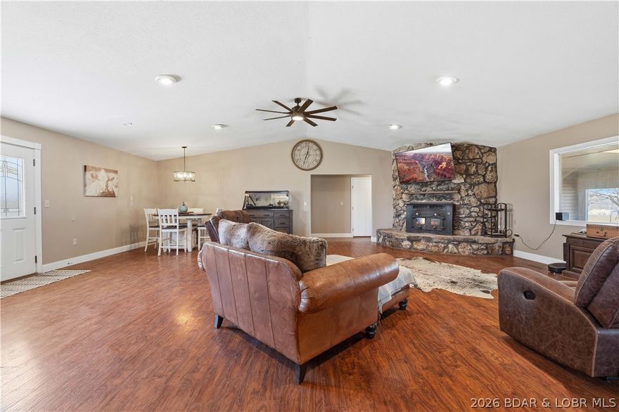 Discover the perfect blend of comfort, functionality, and rural charm with this exceptional 80-acre turnkey cattle farm. The updated 3,028 sq ft home offers 4 bedrooms and 4 bathrooms, fully remodeled in 2019 with modern finishes throughout. The land includes 75 acres of pasture and 5 acres of woods, fully fenced and cross-fenced for rotational grazing, with three ponds and four automatic waterers. Outbuildings include a 40x60 barn with 15-foot lean-tos and 100-amp service, a 22x40 open-front three-car garage, a 12x24 insulated six-run dog kennel with heating and cooling, a 10x14 well house with storage, a chicken coop, and two garden areas. A storm shelter sits just off the back patio. Inside features an open-concept layout with a large mudroom, laundry, guest bath, and kitchen flowing into the living area. The primary suite offers a walk-in shower and Jack-and-Jill vanity. Three additional bedrooms provide flexible space. Dual HVAC systems and separate water heaters add efficiency. Enjoy peaceful views from the front patio and relax on the screened-in back patio. Move-in ready and fully set up for cattle or country living.