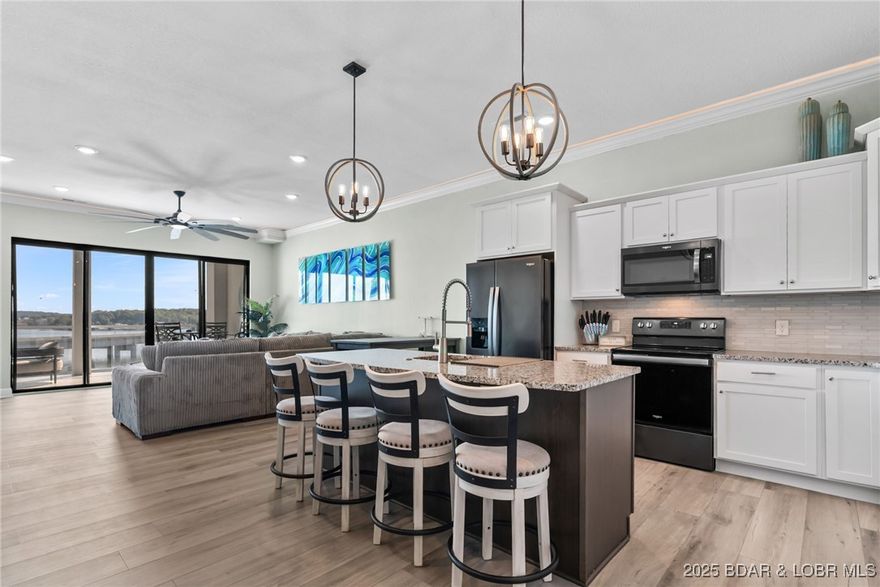 Experience lake lifestyle from the top floor of furnished 3 bed/bath condo at modern Topsider complex including CRUISER SLIP! Enjoy stunning main channel views & all the action on the water from your expansive covered deck, just steps away from the resort-style pools & plush amenities. The massive 16x48 boat slip is perfect for just about any watercraft, making boat days effortless. Step inside this sleek & stylish unit with all the upgrades available like: LED crown molding lighting, glass backsplash, upgraded LVP flooring, granite countertops, black stainless appliances, tiled showers, & Sonos sound system. All the contemporary furniture & furnishings you see are included. So move right in & start enjoying best of the Ozarks now! The open-concept layout is perfect for entertaining, with the lake as your backdrop. All amenities & gym are just an elevator ride away. The prime land/water location means you’re close to all the hot spots the town has to offer! Five minute drive or Uber ride to shopping, dining & entertainment. Whether you’re looking for a weekend retreat or desired nightly rental spot- this condo delivers perfect combo of convenience & fun. Take a look for yourself!