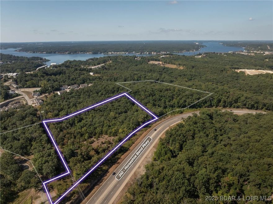 Over 12 acres and 1100 feet of Hwy 242 frontage zoned for commercial activity for $400,000.  With this visibility and this location the possibilities at this price point are many.  Could be a great location to make several pad sites with access directly off of Hwy 242.  Close to water and sewer and everything else Lake Ozark has to offer.  With all of the development planned for this area, this is a steal of a deal!