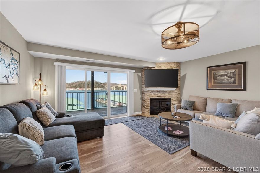 Experience easy lake living in this spacious 3-bedroom, 2-bath condo offering comfort, convenience, and exceptional value. This desirable corner end unit is in excellent condition, filled with natural light and boasts a fantastic view you’ll enjoy from morning coffee to sunset evenings. The open-concept living area flows seamlessly to the outdoors, creating the perfect space for relaxing or entertaining family and friends, while the cozy fireplace adds warmth and charm on cooler lake nights. Sold fully furnished, this condo is truly move-in ready—just bring your suitcase and start enjoying the lake lifestyle. Even better, a generous 12 x 32 ft boat slip and boat lift are included, making days on the water effortless and convenient. Located by water near the 3-mile marker of the Big Niangua, you’re just a short boat ride from The Cave Restaurant and other popular waterfront destinations. Whether you’re looking for a full-time residence, weekend retreat, or investment opportunity, this property checks every box with its prime end-unit location, inviting features, and unbeatable overall value.