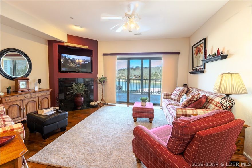 If you are looking for a SMALL and quiet condo complex that offers an elevator that makes every part of living easy here and eliminates all steps from the equation this is a great find.  No vacation rentals for those who seek a quieter way of life that is perfect for full time living or a retreat that sits in the best location with proximity to Camdenton 5 minutes from your door here.  Cove protection with huge views from your covered deck give you a beautiful extension to your living space from a porch that you will live on 3 seasons of the year.  Fully furnished and very well maintained, this condo features updates of hardwood floors, new water
heater, refrigerator, dishwasher, water softener, and HVAC system.  Roof to this condo project was installed in 2024.  Beautifully maintained grounds with a lake side pool, and the sweetest park area for owners that has a fire pit being a beautiful place to gather of an evening.  Ideal place to kayak or paddle board under a covered porch perfect to watch nature. Easy place to walk the dog around complex in an area that is safe and has full time neighbors who watch out for one another.  There is a garage available with added storage.