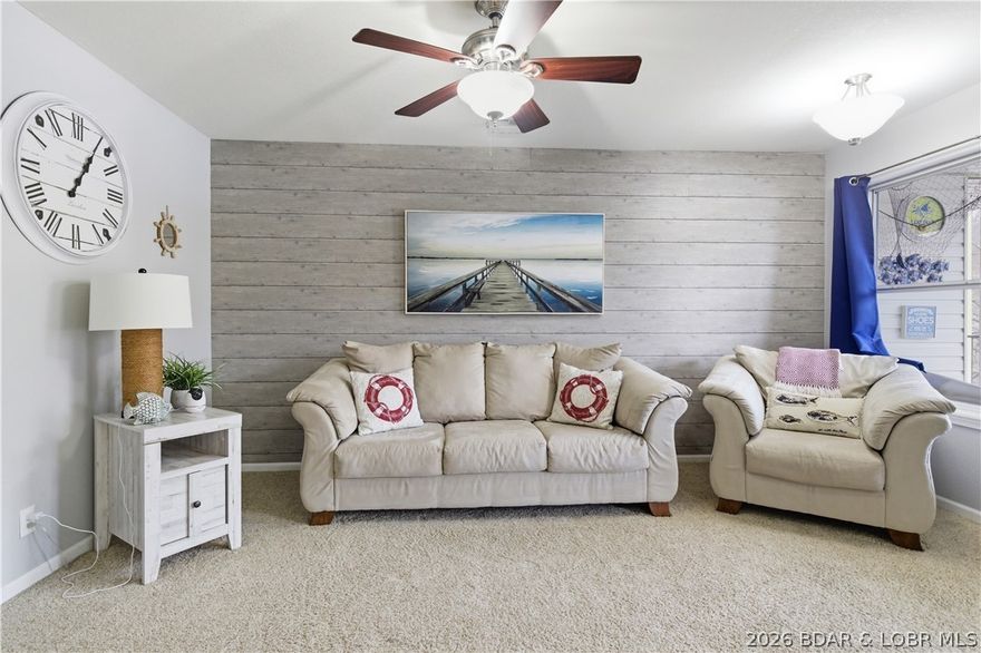 Enjoy lake living in this beautifully located 2-bedroom, 2 bath, waterfront condo at Lighthouse Landing. Ideal as a nightly rental investment, second home or full time residence. The open-concept floor plan offers spacious living with great natural light and comfortable lakefront views from your screened in porch. Conveniently located just minutes from The Bagnell Dam Strip, Osage Beach  shopping, popular lakefront restaurants, and boat rentals. this unit includes a 12x28 boat slip with a 14,000 lb hoist, making it perfect for lake enthusiasts. The complex features excellent amenities including a community pool, swim dock and dog trail. This condo is perfect for relaxation and enjoying The Lake of the Ozarks Lifestyle. Boat for sale for additional cost