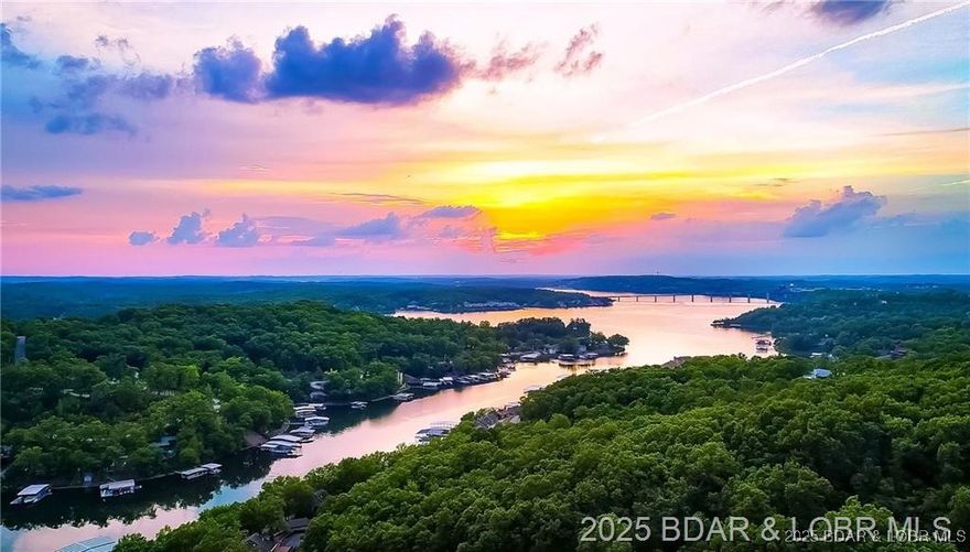 Nestled in the Woods at the Lake of the Ozarks!
This 3-bedroom, 2.5-bath Villa offers 1,524 sq ft of finished living space, tucked away in a peaceful wooded setting at Holiday Shores in the heart of Osage Beach. The open floor plan features vaulted ceilings, a cozy fireplace, and large windows that fill the home with natural light.
The main level includes a spacious kitchen with a new refrigerator, a master suite with full bath, and an airy living/dining area. Upstairs you’ll find a full bedroom loft with vaulted ceilings, ½ bath, and storage. The lower level offers a third bedroom, full bath, and walk-out to a private deck.
Holiday Shores is a beautiful, development offering resort-style amenities including a pool, splash zone, picnic area, fire pit, and lakeside swim dock. A boat slip is available for purchase, and rentals are allowed, making this Villa an excellent option for personal use or investment.
Turnkey-ready with furniture – schedule your showing today!