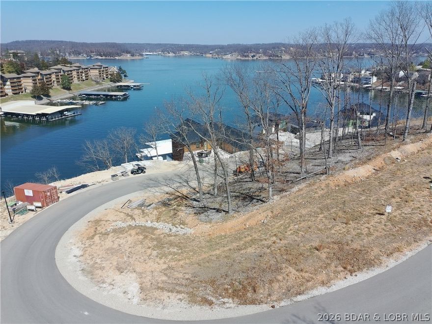 Lot 18 is now ready for you to build your dream home at one of the Ozarks hottest new subdivisions, The Waters. This lot also includes a 14x40 foot boat slip in the brand new community dock! You will also be able to purchase additional PWC slips in the community dock! This lot has a amazing view over looking the 3MM on the gorgeous Lake of the Ozarks. Located off of Hwy HH, you are just minutes from a multitude of lake bars, golf courses, and local hotspots. Don't miss your opportunity to build your LOZ dream house today!