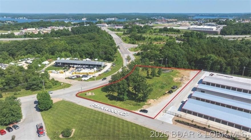 Unlock the potential of 1.91 acres of lightly sloped, open ground perfectly positioned within city of Osage Beach city limits. Zoned C-1 Commercial, this versatile parcel is a developers dream-offering limitless potential from retail and dining to professional office space, hospitality, or mixed-use concepts. Strategically located with convenient access to major thoroughfares, this property sits in one of the fastest growing corridors of the Lake of the Ozarks, surrounded by established business, residential communities, and just minutes from the upcoming Oasis at Lakefront which will boast an amusement park, water park, shopping and a Marriott Hotel.