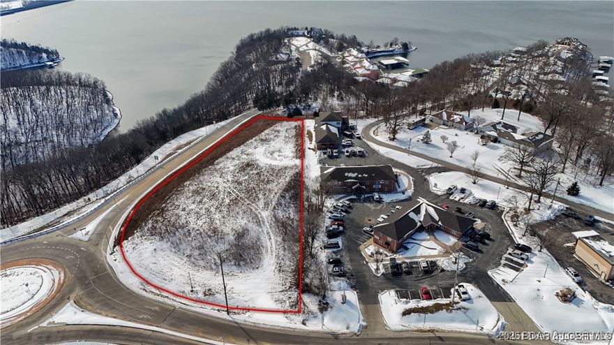 Not many lake view commercial sites locations like this come up. Large lot sits at the corner of Bagnell Dam Blvd and Wilmore Ln, ready to start your project with easy access on and off road and an almost ready build site! Ample road frontage and within visibility of 10,000–20,000 vehicles per day (MODOT) on adjacent highway 54. Additional daily traffic passes directly in front of the site, providing sustained exposure from both local and tourist traffic patterns. Utilities , city water and city sewer are all available. The site’s elevation and orientation deliver views of the 1 Mile Marker, Bagnell Dam, and The Strip, creating a rare opportunity to pair strong fundamentals with a premium visual presence.This is a high-visibility location where nearly every visitor traveling to the Dam drives past. Ideal for retail, QSR, hospitality, or mixed-use development, the site offers strong ingress, signage potential, and long-term value in one of the Lake’s most trafficked corridors.