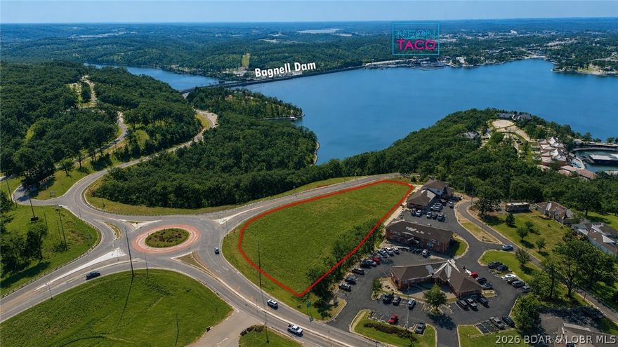 Not many lake view commercial sites locations like this come up. Large lot sits at the corner of Bagnell Dam Blvd and Wilmore Ln, ready to start your project with easy access on and off road and an almost ready build site! Ample road frontage and within visibility of 10,000–20,000 vehicles per day (MODOT) on adjacent highway 54. Additional daily traffic passes directly in front of the site, providing sustained exposure from both local and tourist traffic patterns. Utilities , city water and city sewer are all available. The site’s elevation and orientation deliver views of the 1 Mile Marker, Bagnell Dam, and The Strip, creating a rare opportunity to pair strong fundamentals with a premium visual presence.This is a high-visibility location where nearly every visitor traveling to the Dam drives past. Ideal for retail, QSR, hospitality, or mixed-use development, the site offers strong ingress, signage potential, and long-term value in one of the Lake’s most trafficked corridors.