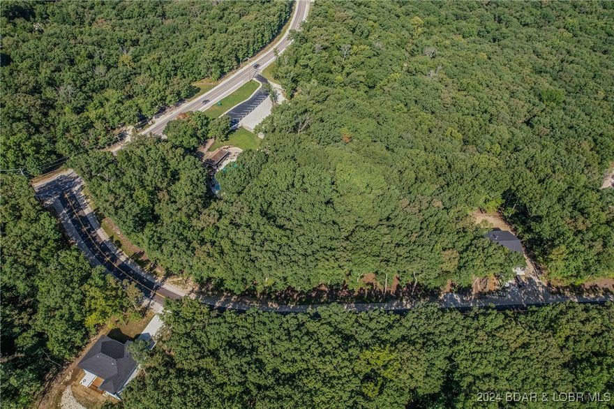 PRIME LOCATION -INCREDIBLE lot that backs up to the Bittersweet Pool!  There are two lots that adjoin together that are avavilble ( MLS 3567480 Lot 1016) so you or your builder may have this opportunity to have a double lot that literially backs up to the community pool! Wouldn't it be great to walk to the pool and not have to take a car of it? (And zero maintenance to worry about, too!) Have a circle driveway for easy access in and out! Check this location out and bring us an offer! Four Seasons has the best amenities for all with interior fishing lakes, tennis courts, pickle ball, 4 swimming pools to go to, hiking trails, walking trails, parks, campground and now the new aquatic center!  And more check out more amenities with maps to all the amenities at www.fourseasonspoa.com (building requirements are under the archetual commitee tab). Stand-by water bill for lot is $87.00 annually. $434 assessment fee is for Four Seasons POA only.  Water hookup available for $4,161 per lot unless you combine the lots together and then it would be just one fee! Need a boat slip? There are numerous marinas on Horshshe Bend. Check these lots out today and build your dream house.