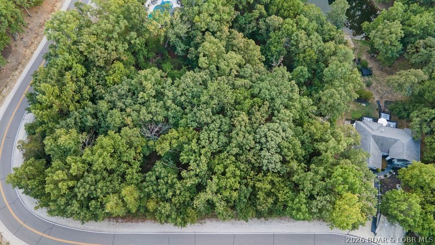 Prime Building Lot in Lake of the Ozarks! Situated just off Horseshoe Bend Parkway on Regency Cove Drive, this 0.35-acre lot offers the perfect setting for your new home at the Lake. With its convenient location near restaurants, golf, and lake attractions, you’ll enjoy both privacy and accessibility. The lot provides a great canvas to design and build your dream property, whether as a full-time residence, or weekend retreat. City utilities available make the building process simple and efficient. Included as part of the Four Seasons Community offering all of its amenities, dog park, playground, pools, campground, boat ramp, trailer parking, and more! Don’t miss this opportunity to secure a homesite in one of the lake’s most desirable areas!