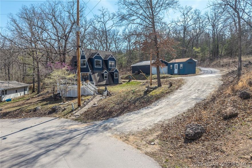 Freshly remodeled, this charming A-frame instantly feels like a getaway the moment you step inside! Selling turnkey, this home blends tropical-coastal style with a relaxed lake house vibe. Luxury vinyl plank and engineered hardwood flooring run seamlessly throughout, adding both style and durability. Offering 2 bedrooms & 2 full baths, including a main-level ensuite, plus a spacious loft area ideal for additional sleeping or flex space. The inviting sunroom is perfect for relaxing or entertaining, with abundant natural light and comfortable seating that creates a true seaside feel. Situated on nearly half an acre, the property provides added privacy with no neighbors behind or on one side, in a family-friendly neighborhood. The freshly graveled driveway leads to an oversized 2-car detached pull-through garage. Multiple community boat ramps are nearby, including one just across the street, making lake access quick and convenient. Whether you’re looking for a full-time residence, weekend retreat, or investment opportunity, this property offers the perfect combination of comfort, style, and location!