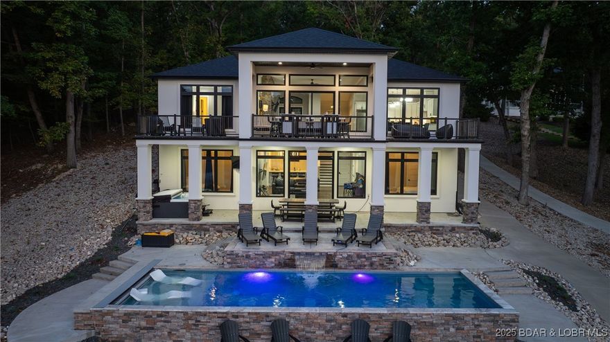 2023 construction, stunning home and is TURNKEY! Stucco & stone exterior finish, up/down lakeside lighting, golf cart path to the dock, heated 12000 gallon salt-water pool with waterfall & auto pool cover, 10 person Hot tub, large windows to maximize views from every room, all while enjoying cove protection off the Osage 14MM. This 6 bed/ 5 bath home has High end Restoration Hardware and Arhaus furniture throughout the home boast a beautiful fireplace, hardwood waterproof floors throughout, quartz counters in kitchen, Top of the line appliances, large pantry. Large furnished deck over looking the pool. Lower level offers a family room full of games & bar area large guest bedrooms, laundry room w/ lots of storage. Head to the pool deck with in pool lounge chairs, fire pit, 3 hole mini golf course completes the ultimate entertainment pad! 14x20 swim dock is included.  FYI.. AMEREN WILL ALLOW A 16x48 & 12x40 2 WELL DOCK  see dock drawing in pictures. Rental income information available by request.