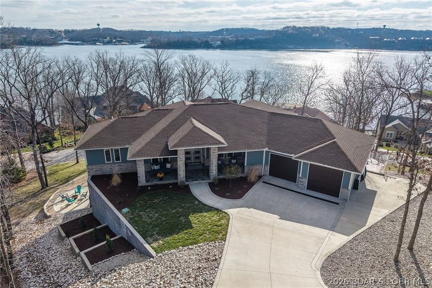 Experience the newest fully furnished luxury residence in Porto Cima, where Mediterranean elegance meets breathtaking Main Channel views of Lake of the Ozarks. Designed for refined living and effortless entertaining, this exceptional estate offers over 6,300 sq ft across 3 expansive levels, connected by a convenient golf cart path to the lower garages & lakefront road. The main level showcases a grand great room with 12-ft coffered ceilings, engineered hardwood floors, and a striking fireplace, opening to a lakeside deck. A modern chef’s kitchen features granite countertops, gas range, and an oversized island, flowing into a sunroom and outdoor grilling terrace with a private swim spa. The primary suite is a serene retreat with spa-inspired bath & custom walk-in closet, complemented by a guest suite and flexible office space. The 2nd level is built for entertaining, offering a family lounge, billiards area & a distinctive Tiki wet bar, along with additional guest accommodations. The 3rd level delivers the ultimate escape with a private theater, game room, and lounge space, plus access to a firepit & additional garage. See Features Sheet that highlights this extraordinary offering.