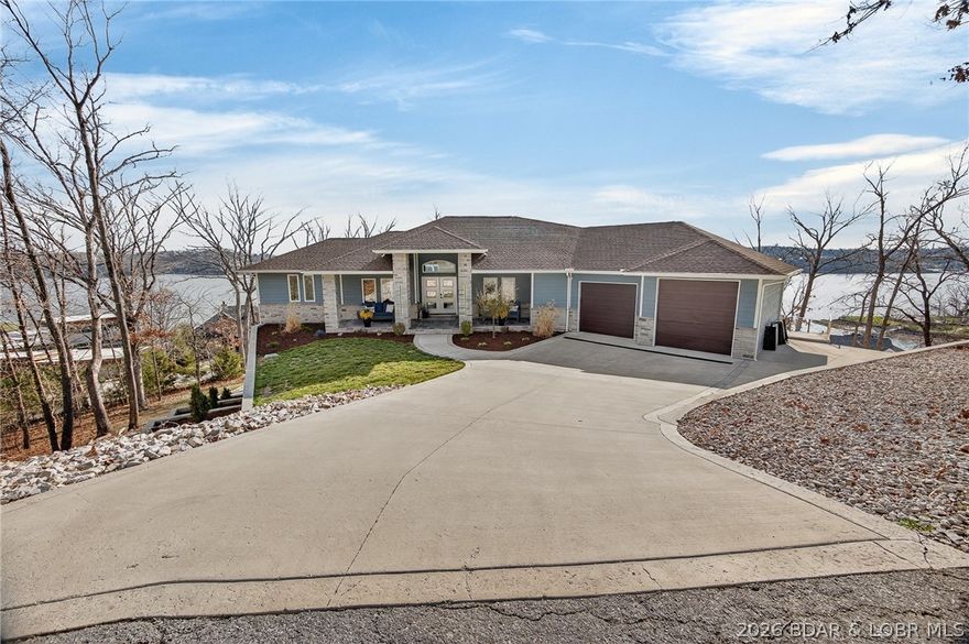 Experience the newest fully furnished luxury residence in Porto Cima, where Mediterranean elegance meets breathtaking Main Channel views of Lake of the Ozarks. Designed for refined living and effortless entertaining, this exceptional estate offers over 6,300 sq ft across 3 expansive levels, connected by a convenient golf cart path to the lower garages & lakefront road. The main level showcases a grand great room with 12-ft coffered ceilings, engineered hardwood floors, and a striking fireplace, opening to a lakeside deck. A modern chef’s kitchen features granite countertops, gas range, and an oversized island, flowing into a sunroom and outdoor grilling terrace with a private swim spa. The primary suite is a serene retreat with spa-inspired bath & custom walk-in closet, complemented by a guest suite and flexible office space. The 2nd level is built for entertaining, offering a family lounge, billiards area & a distinctive Tiki wet bar, along with additional guest accommodations. The 3rd level delivers the ultimate escape with a private theater, game room, and lounge space, plus access to a firepit & additional garage. See Features Sheet that highlights this extraordinary offering.