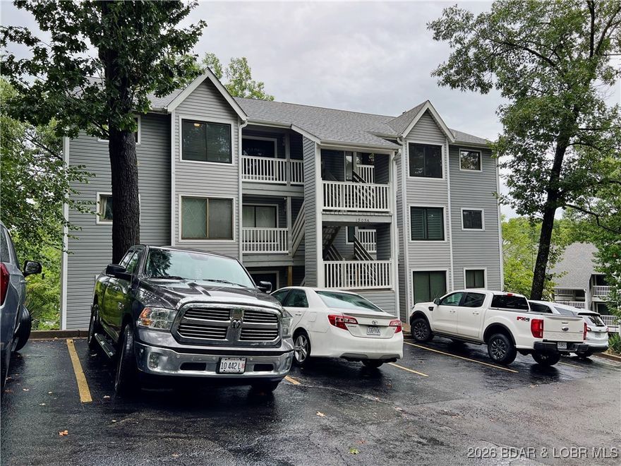 Have you been searching for a condo with a prime location, privacy and LOW ASSESSMENTS!? This condo offers the best of both worlds! Conveniently located in Osage Beach, this unit is within walking distance to Michael's Steak Chalet. The top floor location offers a bright and airy feel with a private deck nestled among the trees. The small complex of only 12 units makes for a quiet and serene experience yet close to town and all the amenities. You will enjoy the tall vaulted ceilings and a second story loft for extra sleeping space, so bring all your family and friends! No need to worry about upcoming maintenance as the unit offers concrete decking, vinyl railings, newer windows and vinyl siding. The meticulously kept interior has been recently updated with easy maintenance LVP flooring and fresh paint. Boat slip rental is available from Freedom Boat Club on site as well as a day dock to enjoy the water. This property is offered totally turn key, so just bring yourself and started enjoying the lake today!!