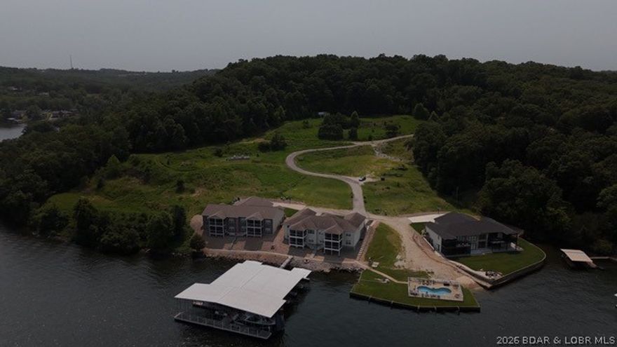 Exceptional development opportunity at Lake of the Ozarks! This 5-acre tract on Wilbus Drive in Sunrise Beach is fully prepped with infrastructure already in place, offering a seamless path for future development. The heavy lifting has already been completed, allowing developers to move forward quickly and efficiently. Enjoy the perfect blend of privacy, convenience, and proximity to lake attractions, dining, boating, and entertainment. Prime development-ready acreage at the Lake is becoming increasingly difficult to find—don’t miss this outstanding investment opportunity. Buyer will receive 2-12x32 boat slips and 3 PWC slips and ownership of the pool. Buyer is willing to trade, get creative and bring your offers!