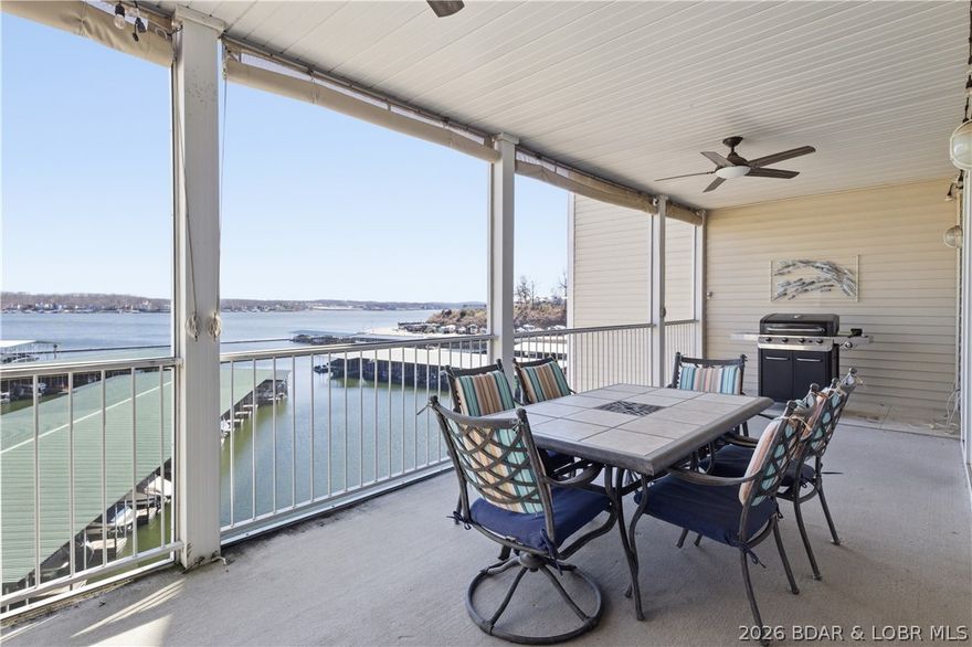 Welcome to effortless lakefront living at the Lake of the Ozarks! This beautifully updated 3-bedroom, 2-bath
condo offers an open floor plan designed to maximize space, light, and those incredible lake views. Recent
updates include stylish flooring and modern appliances, creating a fresh, move-in-ready feel throughout. Step
out onto the large screened-in deck and take in sweeping main channel views while still enjoying the calm,
protected waters of the cove—perfect for relaxing or entertaining. Boaters will love the included 40’ boat slip,
along with the convenience of elevators providing easy access to parking and the dock. The immaculate, quiet
complex offers excellent amenities, including a pool and fitness center, making it ideal for full-time living or a
weekend getaway. Located on the desirable west side of the lake, you’re just minutes from popular on-thewater destinations like Tap and Grill, Shady Gators, and H. Toad’s—close to the action yet tucked away in a
peaceful setting. This is the perfect blend of comfort, convenience, and classic Lake of the Ozarks lifestyle.