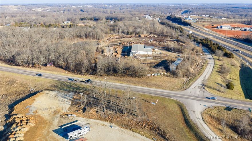 Prime commercial outparcel with outstanding highway visibility along one of Eldon’s busiest corridors. This 0.45± acre tract is positioned directly along Highway 52, offering exceptional exposure to year-round traffic traveling to and from the Lake of the Ozarks. The site captures steady flow from both regional commuters and lake-bound travelers, making it ideal for businesses that rely on strong drive-by presence.

Highway 52 serves as a primary route for Kansas City traffic heading to the lake, while its proximity to Highway 54 connects the property to a major corridor used by St. Louis travelers, delivering consistent visibility and strong daily traffic counts. The location benefits from excellent sight-lines, easy access, and prominent frontage in a highly traveled area.

With its efficient size and strategic placement, this parcel is well-suited for a gas station out-lot, quick-service restaurant, retail pad, or service-oriented commercial use seeking maximum exposure without excess land.

Highly visible. Strategically located. Commercial-ready. Opportunities of this caliber along the primary gateways to the Lake of the Ozarks are increasingly rare.