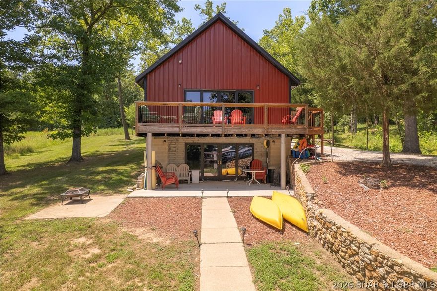 DOCK with single well, 12x28 slip is permitted by Ameren. TURN KEY! Just appraised at $360K! Enjoy the perfect blend of modern design and serene country lakefront living in this quaint 2023 build. The open-concept main level features a living area, a full bedroom, a full bath, and double glass doors leading to an expansive deck overlooking the water. Upstairs, a versatile loft offers endless possibilities—ideal for extra sleeping space, a home office, or a kids’ playroom. The finished lower level expands your living options with extra family living area, dining area, wet bar, full bath, and room for more beds—plus a walk-out patio for easy lake access. Outside, an inviting large level yard surrounded by mature trees faces the lake for family get togethers. Let the kids enjoy their own sand beach at the water’s edge for those sunny summer days. With nightly rentals, this home can be an income producing investment or a private get-away. Book your showing today!