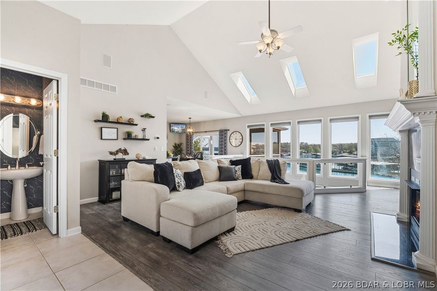 Rare opportunity in the heart of Osage Beach—lakefront living with space, privacy, and incredible shoreline! Situated on 1.19 acres inside a private gated community, this beautifully updated 4-bedroom, 2 are en-suites,3.5-bath home offers 2,944 sq ft and an impressive 271 feet of lake frontage—plus your own private beach, something you rarely find at the lake.
Sold turn-key and updated inside and out, this home is designed for easy living and entertaining. The main level features an open layout with a wall of windows showcasing stunning lake views and true main-level living. The walkout lower level includes a spacious bar area, perfect for hosting family and friends, along with a second laundry for added convenience.
Outdoor living is unmatched with expansive deck space on both levels and a massive screened-in deck just off the kitchen—ideal for enjoying the lake in every season. A cart path leads you to a deep-water concrete dock with 3 slips, making lake days effortless.
Private, spacious, and move-in ready—this is a one-of-a-kind lakefront retreat.