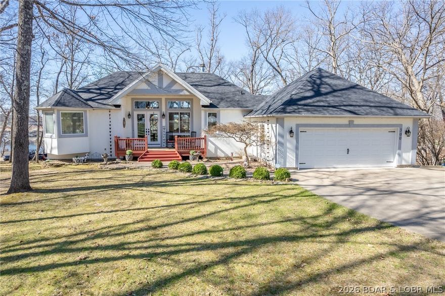 2732SF Porto Cima Lake view home with 4BR 3 ½ BA 2 Car Garage. This luxurious home is loaded with features that add charm & value. Originally a custom build from a reputable local builder, this is not a cookie cutter, builder grade home.On a large lot with lake views, you access the two car garage from the flat driveway. For more space, the adjoining point lot is available. Convenient main level living offers Kitchen, Dining, Living Room, Laundry, Half Bath & Main Suite. Spacious decks are accessible from the main suite & the dining/kitchen area & the garage. The decks stretch across the length of the house with wooded & lake views. Inside you’ll find vaulted, beamed ceilings, stone fireplace & walls of windows to take in the surroundings. A mated pair of Eagles have a nest that can be viewed from the home.Lower Level has 3BR & 2BA, family room & walks out to patios & a partially fenced yard. Amenities include pools, clubhouses, social clubs, boat launch facilities, golf, tennis, pickball, playgrounds & more. Optional leased 12x25 boat slip. Updates & remodels have been done from 2019-2025: see attachment or listing agent for a copy of the Update List. Be sure to watch the video