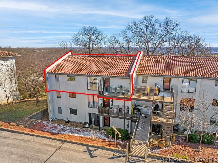 MOTIVATED SELLER! Please bring all reasonable offers! This beautifully located 2 bedroom, 2 bath condo offers the perfect blend of comfort, convenience, and resort-style living. Situated in a prime spot, you'll enjoy easy access to everything the area has to offer. This property is perfect for full-time residence, vacation getaway, or an income-producing investment. The front balcony faces both the kids' pool and the adult pool - perfect for relaxing or keeping an eye on family fun. Out back, take in stunning views, which include The Cove Golf Course and Downing Branch Cove in the distance, creating a peaceful, scenic backdrop that guests and owners alike will love. With plenty of room to unwind, access to multiple pools and the marina at the Lodge of Four Seasons, and only 5 minutes from the Bagnell Damn Strip, this condo makes it easy to embrace the lake lifestyle!