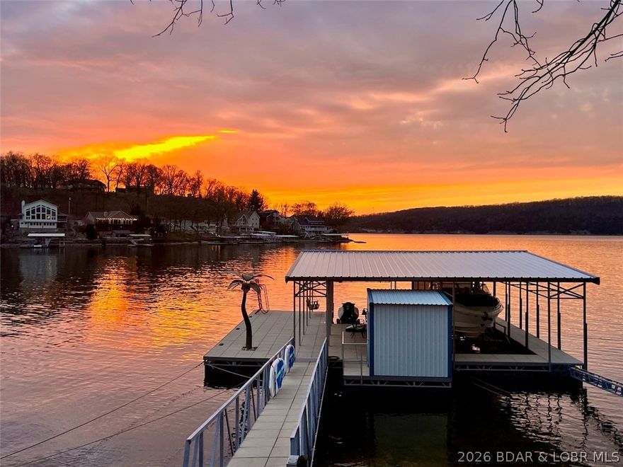 LOOK NO MORE. This home is the perfect getaway on Turkey Bend. This lakefront home features a year-round main channel sunset view and is only a few steps from your newer cement dock. 
This lovely home offers plenty of square footage, large windows, an inviting floor plan, an open kitchen and living room, 3 bedrooms, an extra lower level room can be used as bedroom, den, dining room or second living room, 3 full bathrooms, a fireplace, mostly furnished, turnkey, and has an awesome view from almost every room. A few of the many features include a subdivision boat ramp next door, deep water, plenty of parking, a storage shed, a newer boat dock, a dock shed, and 3 boat lifts (Boat lifts are offered for extra money). This home is waiting for someone like you to care for it in the years to come! This home sits on a large, low-maintenance lot with plenty of room between neighbors and room to build a large garage. This house has a lot of potential to be your lake home! The sunsets are worth the price of admission alone! Located in the heart of the Osage Beach area, close to offices, shops, restaurants, and your favorite hangouts.