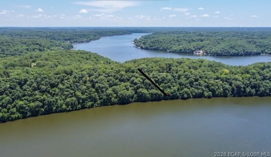Check this one out! Seller said bring offers! Price to sell at $546/per waterfront ft. Desirable Gravois Arm. Big cove. Stunning views from this larger waterfront property with perfect flat building spots to build your dream home. NO Planning and zoning. BRING THOSE OFFERS