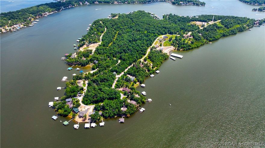 Welcome to Big Island at Lake of the Ozarks—one of the most unique and desirable communities at the Lake. All lots in this golf cart-friendly subdivision offer beautiful lake views and are fully ready to build, with water, sewer, electricity, and high-speed fiber internet already in place. Big Island is the only subdivision at the Lake offering more boat slips than lots—ensuring ample availability for your lake toys. Current slips include 12x32, 18x44, and 18x48 options—call for current dock pricing and availability. Residents enjoy outstanding amenities including a community boat ramp, swimming pool, and a peaceful, private setting ideal for full-time living, vacation homes, or investment properties. Whether you're building a single dream home or planning a multi-home development, Big Island delivers flexibility, views, and unbeatable lake access.