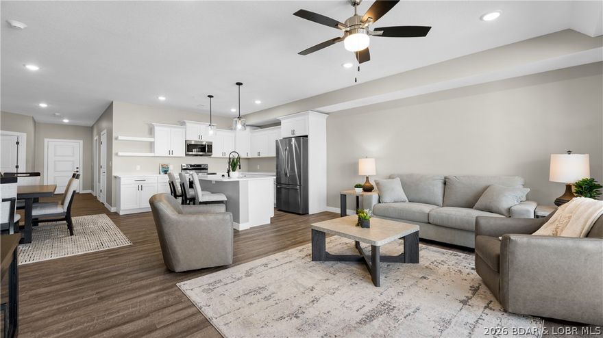 Only 3 Units Left!!! Enjoy stunning main channel views and gentle lakefront access from this beautifully positioned condo tucked inside a large protected cove w/ main channel views—ideal for dock protection and peaceful waterfront living. This highly desirable 3-bedroom, 3-bath floorplan features all en-suite bedrooms and is located just one level down from parking for easy access. Elevator service takes you to every amenity, including two pools, pet area, and no stairs to the dock. Inside, you'll love the open-concept design with upgraded flooring, granite throughout, stainless steel appliances, kitchen pantry, and a luxurious primary suite featuring double vanities, walk-in tiled shower, and spacious storage. Oversized laundry room adds convenience, while 8-foot sliders frame breathtaking Lake of the Ozarks views and open to spacious decks with storage closet (screening optional). Conveniently located just minutes from top lake amenities by land or water. Dock slips and PWC spaces available at additional cost in multiple sizes. Developer also offers optional furnishing packages for a true turn-key purchase—call for details.