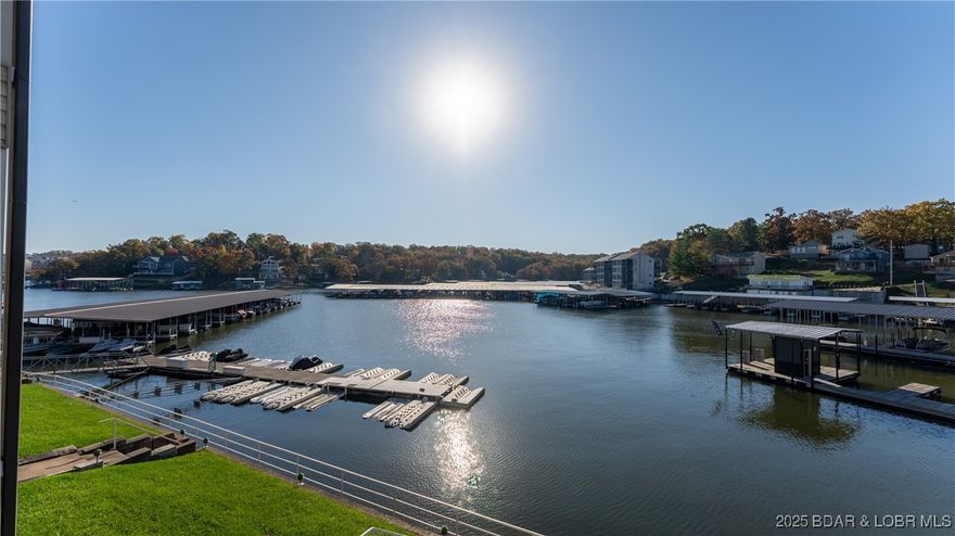 Completely Remodeled, Feels like you are sitting on the water, Walk In Unit. Harbor Point Condominiums! Nestled at the sought-after 21MM of Lake of the Ozarks, this beautifully remodeled 2-bedroom, 2-bathroom end unit offers unparalleled convenience and charm. Boasting walk-in access, this condo features custom cabinets, shiplap accents, high-end appliances, stunning handmade walnut countertops, and a farmhouse sink that ties together the modern yet cozy aesthetic. Fully furnished and turn-key, this property is perfect for a relaxing vacation getaway or a lucrative nightly rental. Step outside to enjoy the community amenities, including a pool, tennis court, and clubhouse. Your private 10x30 boat slip is just steps away, ensuring effortless lake days. Don’t miss the chance to make lifelong memories in this exceptional lakefront condo. Schedule your showing today and see why Harbor Point is the perfect place to call home!