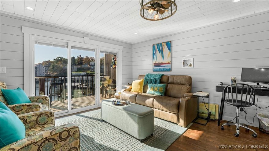 Completely Remodeled, Feels like you are sitting on the water, Walk In Unit. Harbor Point Condominiums! Nestled at the sought-after 21MM of Lake of the Ozarks, this beautifully remodeled 2-bedroom, 2-bathroom end unit offers unparalleled convenience and charm. Boasting walk-in access, this condo features custom cabinets, shiplap accents, high-end appliances, stunning handmade walnut countertops, and a farmhouse sink that ties together the modern yet cozy aesthetic. Fully furnished and turn-key, this property is perfect for a relaxing vacation getaway or a lucrative nightly rental. Step outside to enjoy the community amenities, including a pool, tennis court, and clubhouse. Your private 10x30 boat slip is just steps away, ensuring effortless lake days. Don’t miss the chance to make lifelong memories in this exceptional lakefront condo. Schedule your showing today and see why Harbor Point is the perfect place to call home!