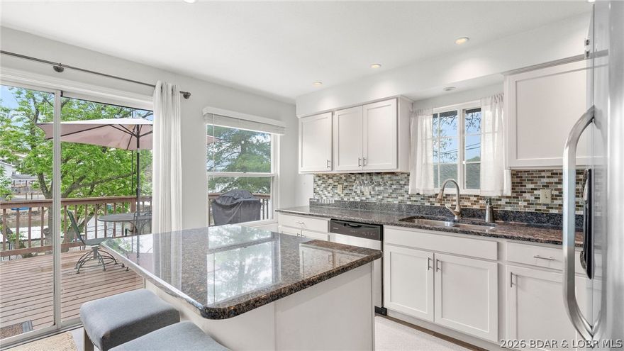 Welcome to lake life at its finest! This beautifully maintained home offers the perfect blend of comfort, charm, and functionality. Ideally situated on the water in a prime location located on the Gravois 8, walking distance to Maggies and around the corner from your favorites like Coconuts! You’ll enjoy easy boating access and close proximity to some of the lake’s most popular restaurants and waterfront hotspots. Whether you're heading out for a quick dinner by boat or a full day on the water, convenience is at your fingertips. Inside, the home features a bright, open layout with plenty of natural light, spacious living areas, and a well-appointed kitchen perfect for entertaining. Step outside to relax on the deck and take in the peaceful lake views. Whether you're looking to unwind or host guests, this property checks all the boxes. Don’t miss your opportunity to own a slice of Lake of the Ozarks paradise!